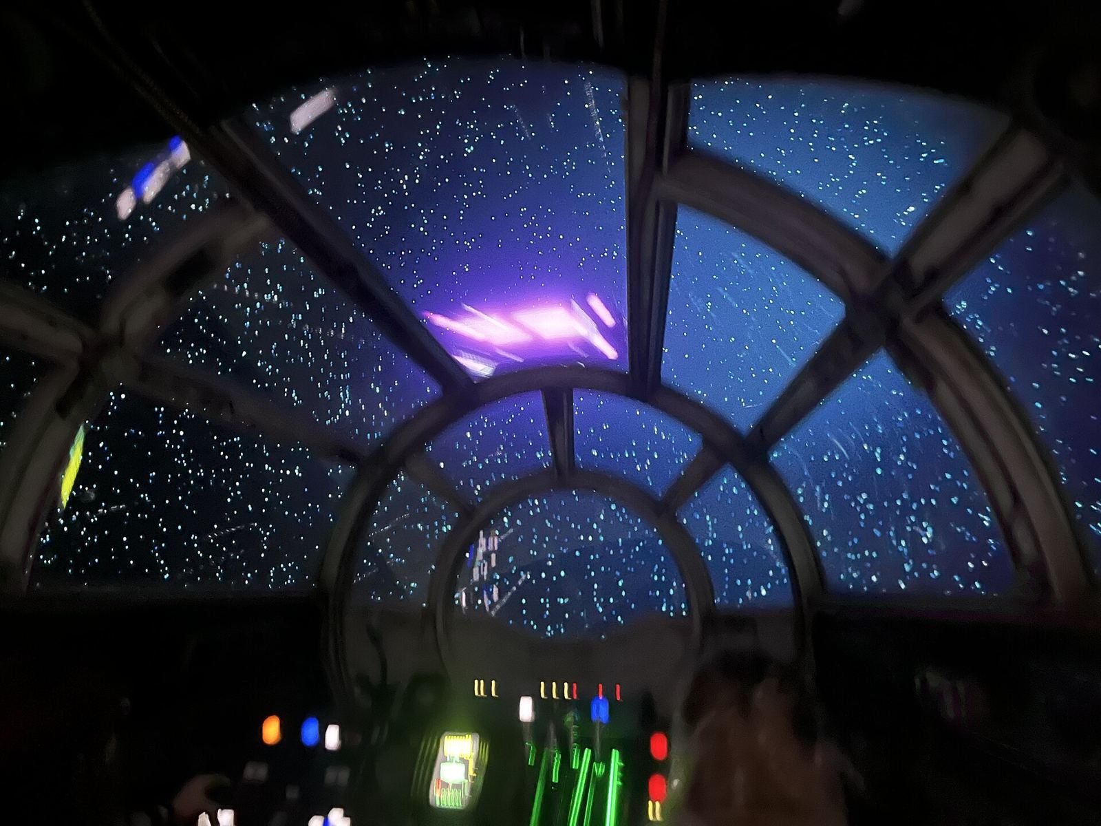 View of space through a ship's window in a scene from Star Wars: Rise of the Resistance at Disney's Hollywood Studios